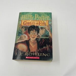 Scholastic Paperback — Deep Red Cover with Gold Accents